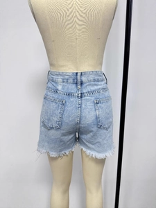 Slim fit light blue denim shorts for women featuring back pockets and frayed raw hem