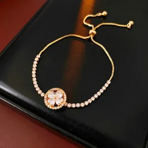 Golden clover rotating bracelet with cubic zirconia and adjustable slide closure