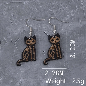 Detail view of gothic black cat skeleton wooden earrings with size and weight specs