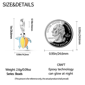 Detailed size comparison of a luminous sea turtle pendant with a US quarter coin