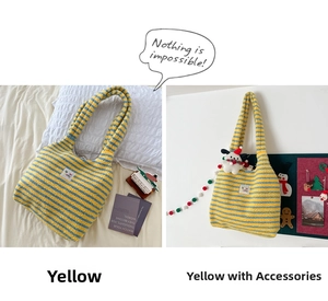Detail of yellow and blue striped plush knit tote bag with long shoulder strap