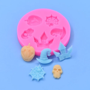 Pink silicone mold for Halloween DIY cakes with pumpkin, castle, and skull shapes