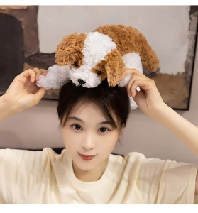 Close-up of curly plush puppy toy with soft white and brown fur texture on woman head