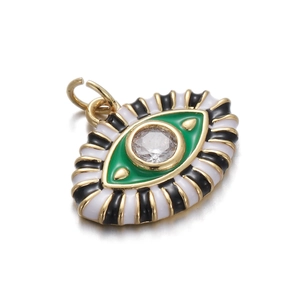 Macro view of gold-plated Evil Eye pendant with green enamel and sparkling zircon stone