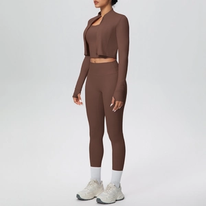 Detailed 45-degree side view of chocolate brown three-piece yoga set with jacket and leggings