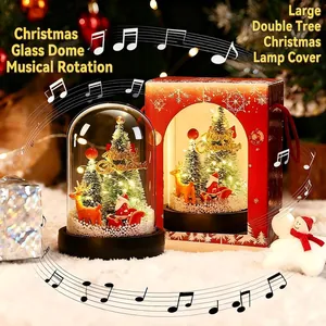 Rotating musical glass dome with Christmas trees, reindeer, and LED light in a gift box