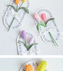 Detail of handmade crochet tulips in various colors with elegant gift cards and ribbons