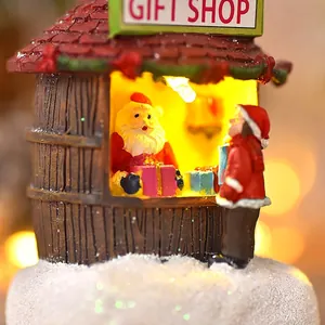 Lighted Christmas resin gift shop miniature with Santa Claus and festive warm LED glow