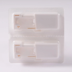 Dual pack of disposable ear piercing units with white shell and sterile gold studs