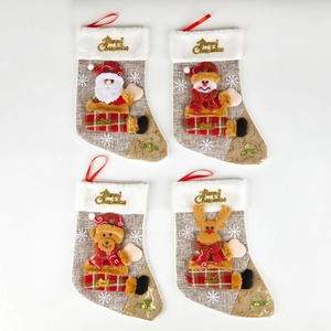 Set of four burlap Christmas stockings with 3D Santa, Snowman, Bear, and Reindeer designs