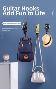 Detailed view of guitar headstock wall hooks in various colors for creative home storage