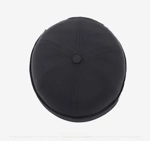 Top view of a black docker hat featuring a six-panel stitch and classic button top