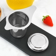 Top view of 304 stainless steel tea infuser set with fine mesh strainer and lid on marble