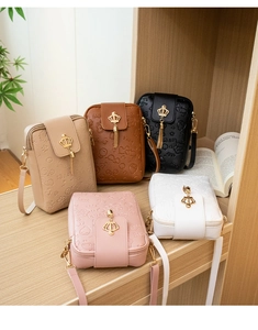 Tassel crossbody phone bags with crown ornaments displayed in five different colors