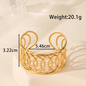 Wide vintage gold stainless steel cuff bracelet with hollow floral geometric design