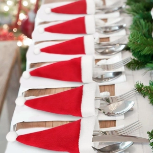 Set of 6 red Christmas hat cutlery holders for holiday table decor with spoons and forks