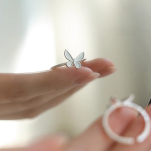 Elegant butterfly-shaped S925 sterling silver ring shown on hand with fine textures