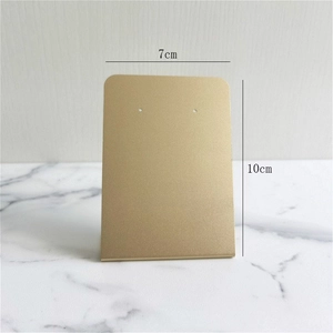 Detailed view of gold metal earring display stand showing 10cm height and 7cm width dimensions