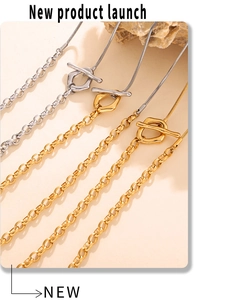 Close-up of gold and silver two-tone necklace with OT toggle clasp and mixed chain links