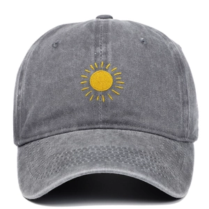 Vintage grey washed cotton baseball cap with yellow sun embroidery in a front view