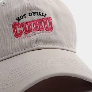 Macro detail of the 3D embroidered lettering on a high-density cotton baseball cap