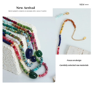 Detail of multi-colored natural stone beaded necklaces with gold lobster clasp closures