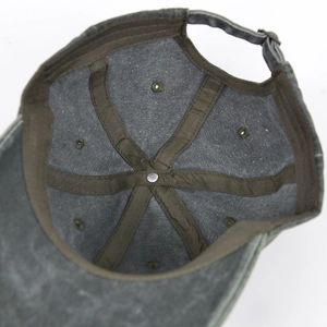 Detail view of the washed grey cotton baseball cap interior showing six-panel stitching