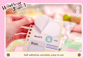 Close-up of peeling self-adhesive macaron planner stickers for scrapbooking material