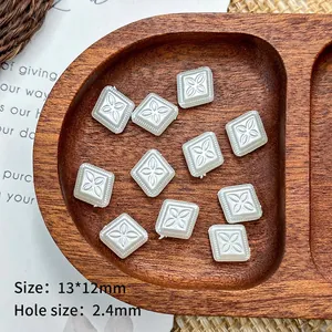 Detailed view of 13x12mm pearl white square flower beads with 2.4mm aperture for DIY crafts