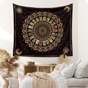 Bohemian moon phase tarot tapestry with sun and star mandalas hanging above a bedroom bed