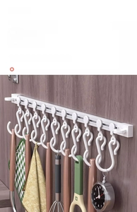Sliding rail wall hook showing flat design and multiple hooks for kitchen utensils