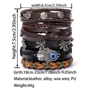 Detail view of multi-layer leather bracelet with Hamsa Hand and Evil Eye charms