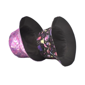 Two reversible bucket hats featuring magic mushroom and psychedelic cosmic patterns