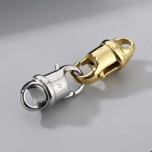 Macro view of interlocking gold and silver titanium lobster clasps for jewelry making