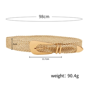 Detail of woven straw belt featuring a gold geometric metal buckle and size measurements