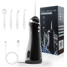 Kit idropulsore orale nero portatile con quattro ugelli, cavo USB e confezione regalo