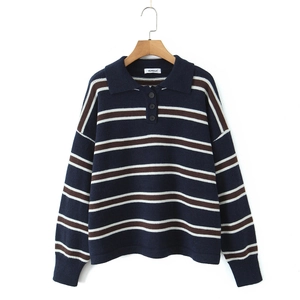 Retro striped knit polo shirt with navy and brown contrast stripes on a wooden hanger