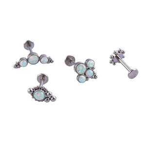 Classic stainless steel opal labret studs with white synthetic gemstones set in a four-piece kit