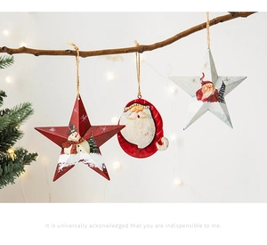 Detail of tin Christmas ornaments with Santa and snowman motifs hanging on rustic branches