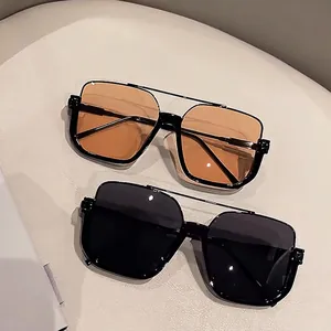Retro oversized tea-lens sunglasses with a black square frame and stylish double bridge