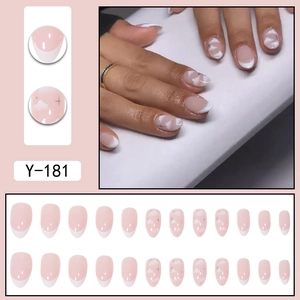 Short pointed French press-on nails with pink base, white clouds, and stars design