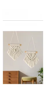 Detail of bohemian cotton rope wall hanging with handcrafted fringe and wooden dowel