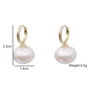 Detail showing 22mm french style pearl hoop earrings with 14mm diameter pearl size