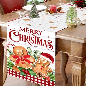 Festive gingerbread man Christmas table runner with Merry Christmas print on wooden table