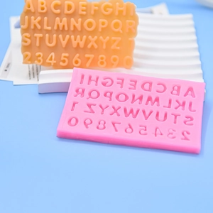 Pink silicone mold featuring uppercase letters and numbers for DIY fondant cake baking