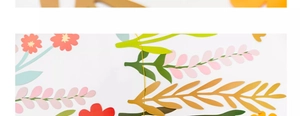 Detail of colorful paper flower banner for window display featuring multi-color floral cutouts