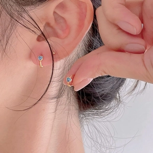 Elegant 925 sterling silver heart earrings with blue zircon in a gold finish setting
