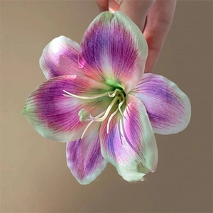 Detailed close-up of a realistic lily flower hair clip with purple and green gradient petals