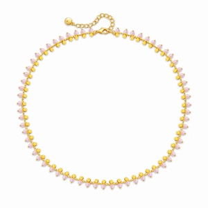 Bohemian choker necklace with pink beads and golden discs in a circular layout