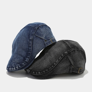 Vintage washed denim flat caps in blue and grey with adjustable metal side buckles